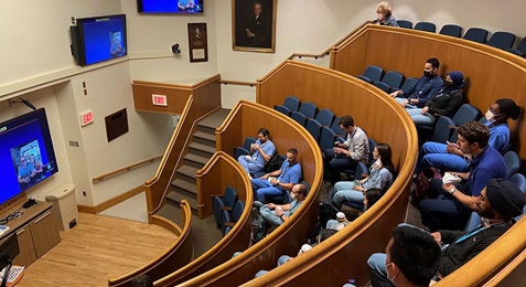 Penn Radiology Residents seated in Donner Auditorium for lecture, Summer 2021